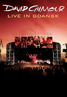 alt="Filmed at the final show of David Gilmour's 2006 On An Island Tour, the show at the Gdańsk Shipyard featured an audience of 50,000. David Gilmour and his band were backed by the Symphony Orchestra of the Polish Baltic Philharmonic Orchestra, conducted by Zbigniew Preisner. Songs include: On An Island, High Hopes, A Great Day For Freedom, Echoes and Comfortably Numb."