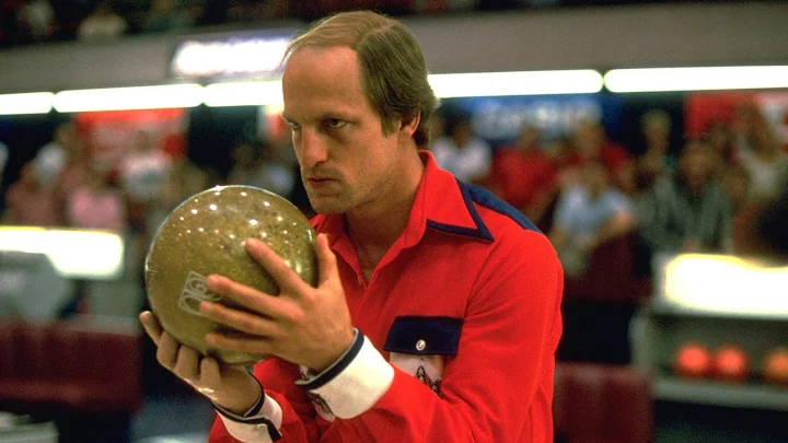 Roy eyes the bowling lane in preparation for an important frame