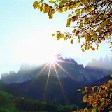 Morning sun in the mountains icon