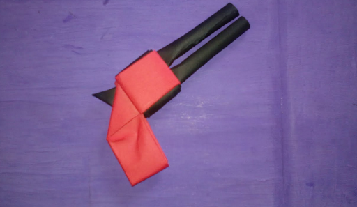 Origami paper guns. Cardboard weapons